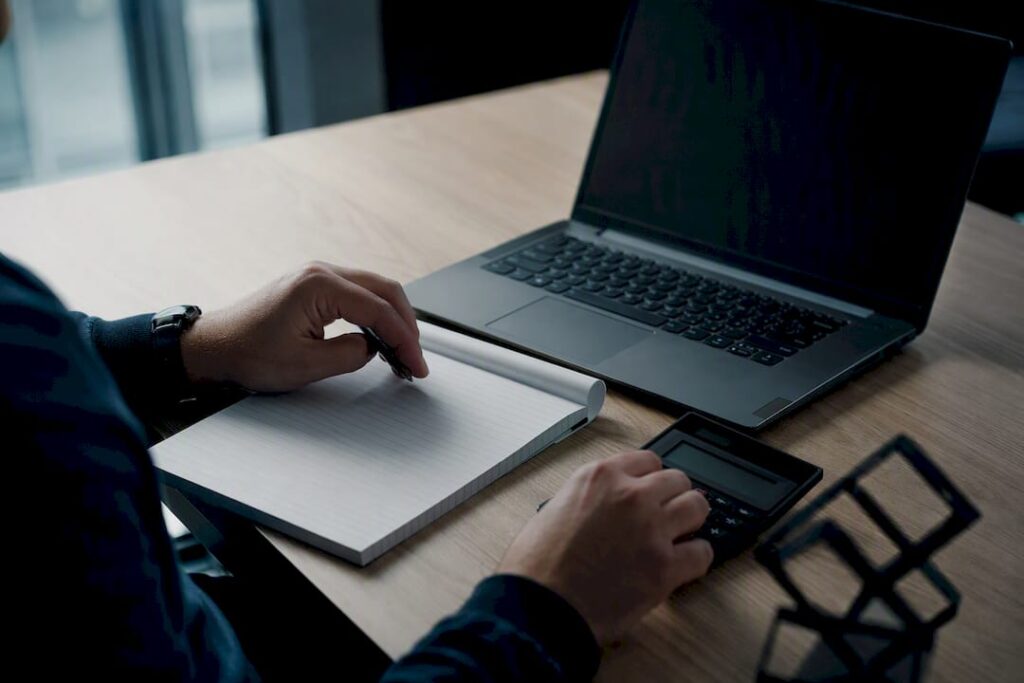 Trader doing forex calculations by hand