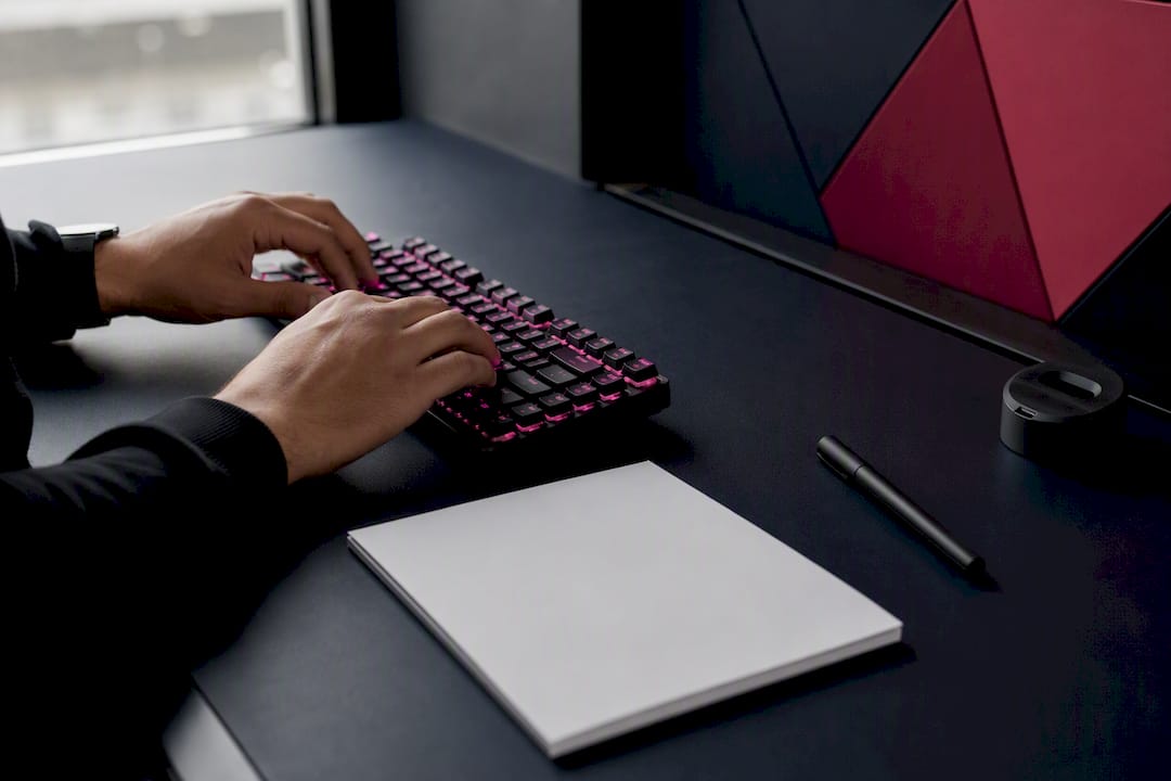Hands preparing forex trading tools on desk